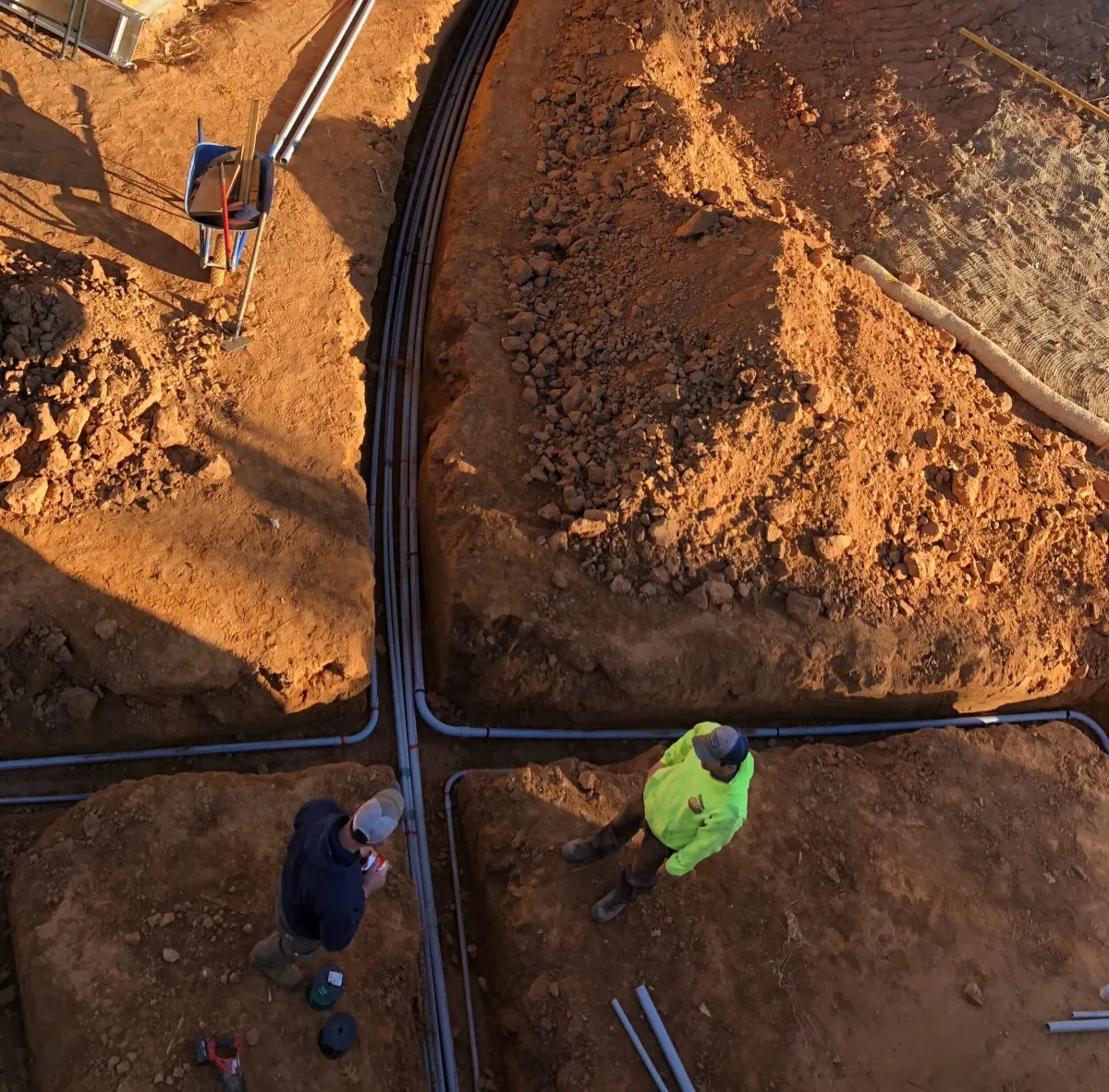 Overhead view of utility trenches with conduit
